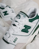 White and green New Balance 550 sneakers close-up, leather upper, streetwear shoes