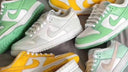 Assorted pastel green, yellow, and white women's low-top sneakers arranged on a flat surface