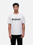 Person wearing a white t-shirt with 'dropout' text on a white background