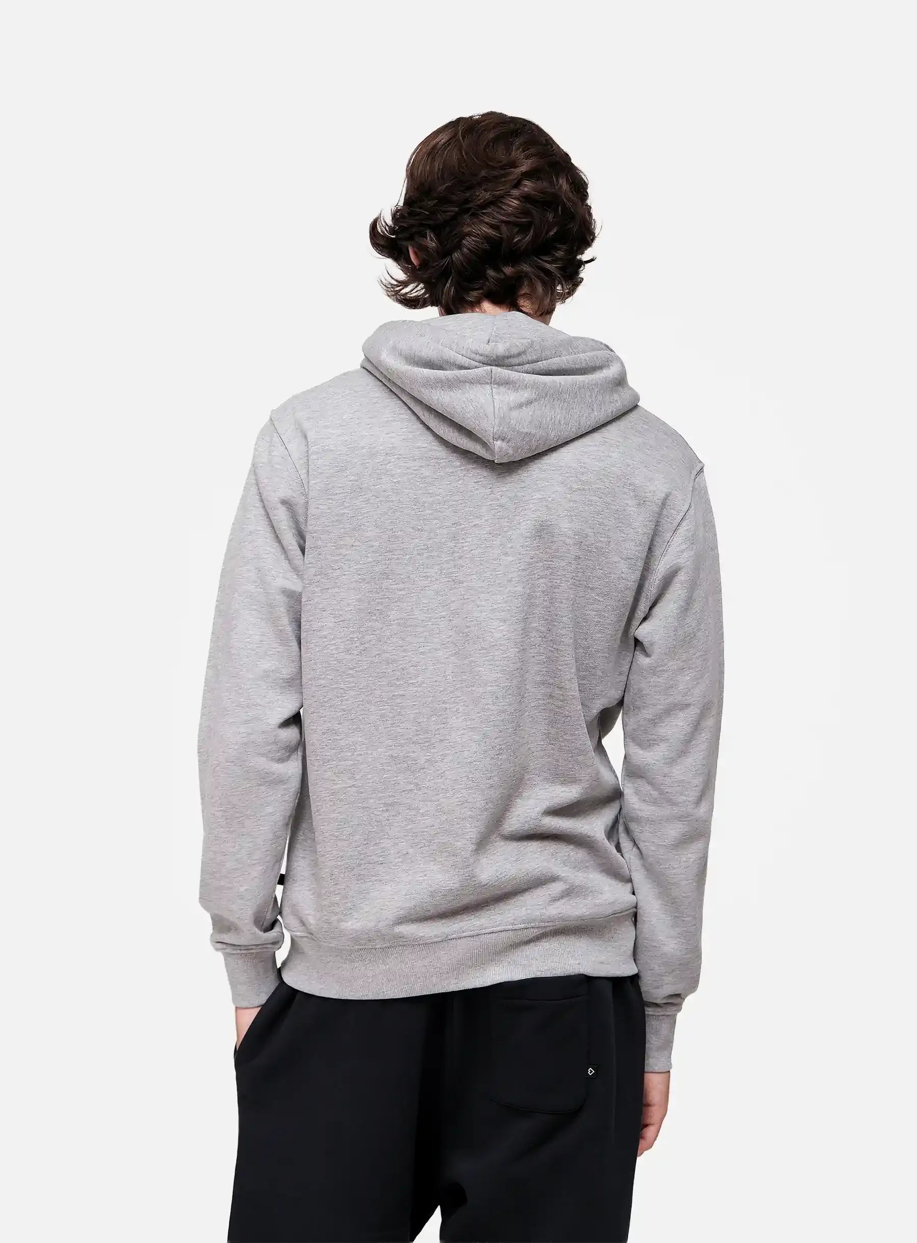 Person wearing a grey hoodie from behind on a white background