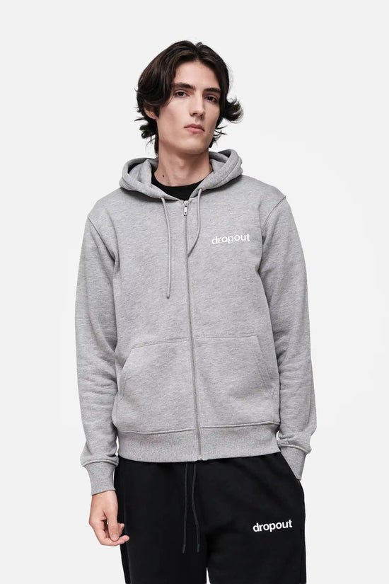 Person wearing a grey hoodie with 'dropout' logo on a white background