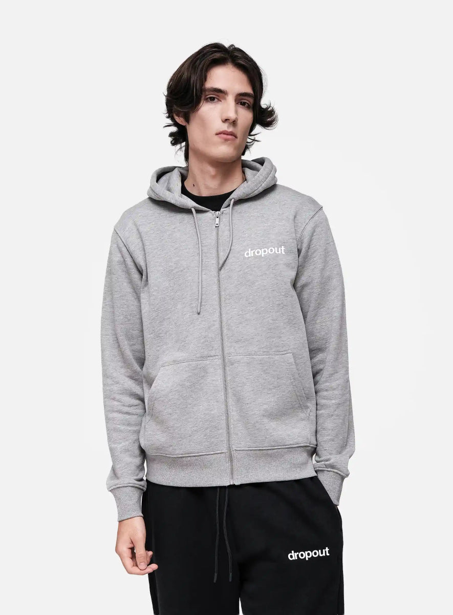 Person wearing a grey hoodie with 'dropout' logo on a white background