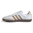 White sneaker with brown stripes on a white background