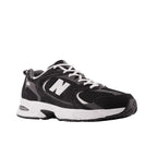 Black and white New Balance sneaker with mesh and suede details, side profile view