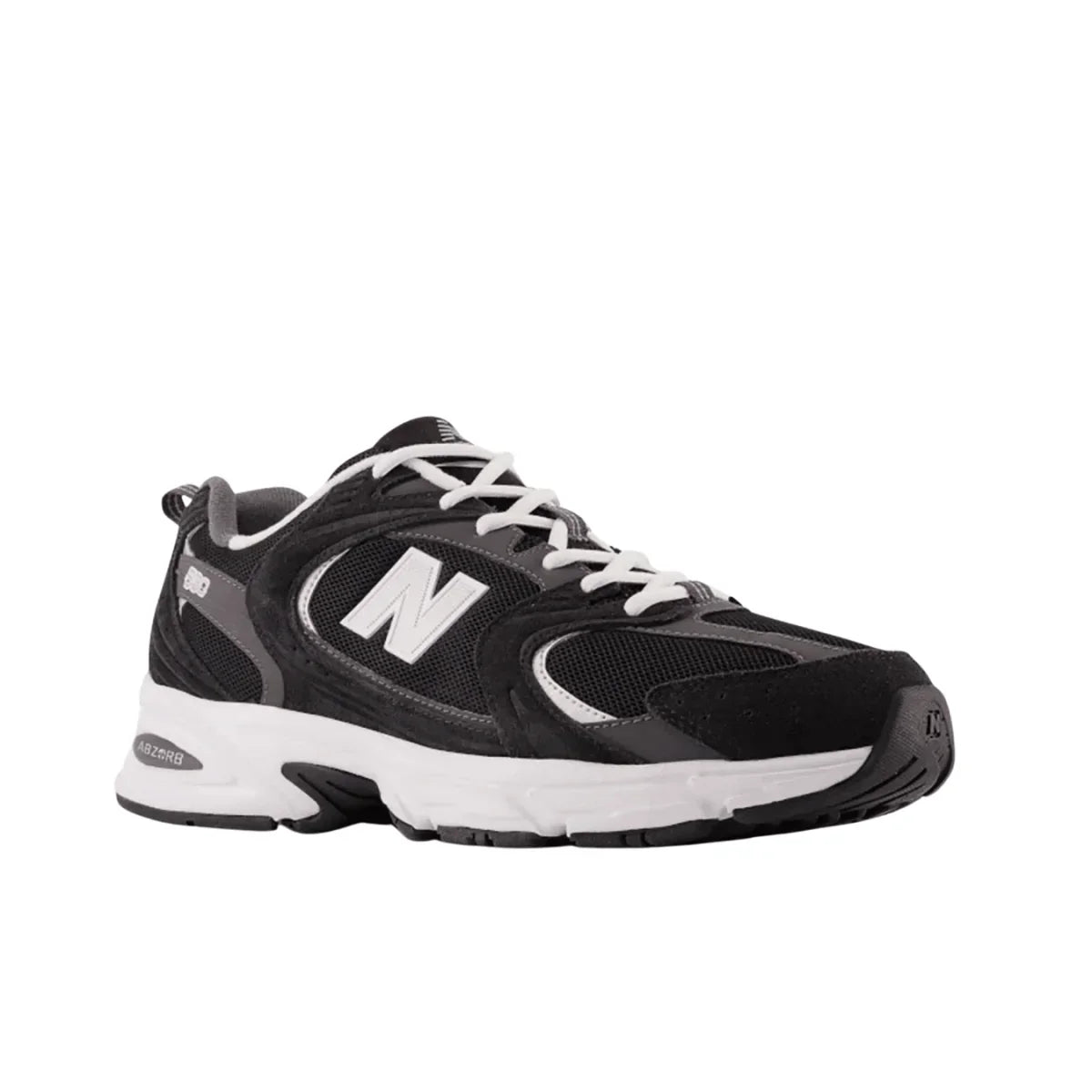 Black and white New Balance sneaker with mesh and suede details, side profile view