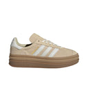 Beige Adidas sneaker with white stripes on a white background