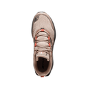 Tan knit sneaker with black sole and orange lace accents, top view on white background