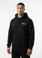 Man wearing a black hoodie with 'dropout' logo on a white background