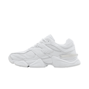 All-white chunky streetwear sneaker with mesh and leather panels, side profile