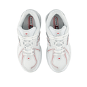 White New Balance 1906 sneakers top view, mesh upper with red and silver accents, streetwear