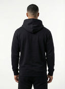 Person wearing a black hoodie from behind on a white background