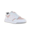 White and pink sneaker with New Balance logo on a white background
