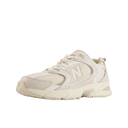 Beige mesh and suede low-top sneaker with chunky sole and streetwear style on white background