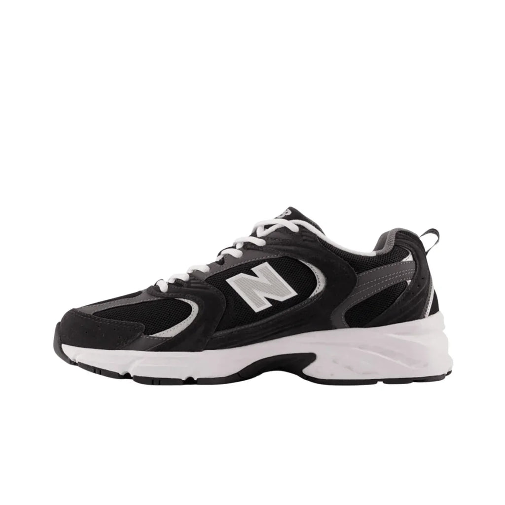 Black and white streetwear sneaker with mesh and suede details, side N logo, white sole