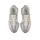 Top view of white and beige New Balance streetwear sneakers with grey suede accents