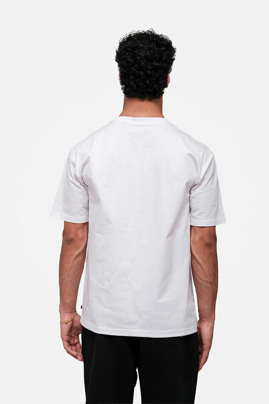 Person wearing a plain white t-shirt on a white background