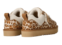 Pair of sneakers with leopard print pattern on a white background