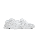 All-white chunky sneakers with mesh and leather details, side view, streetwear footwear