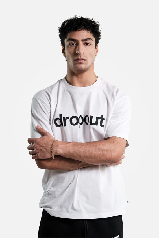 Person wearing a white t-shirt with 'dropout' logo on a white background