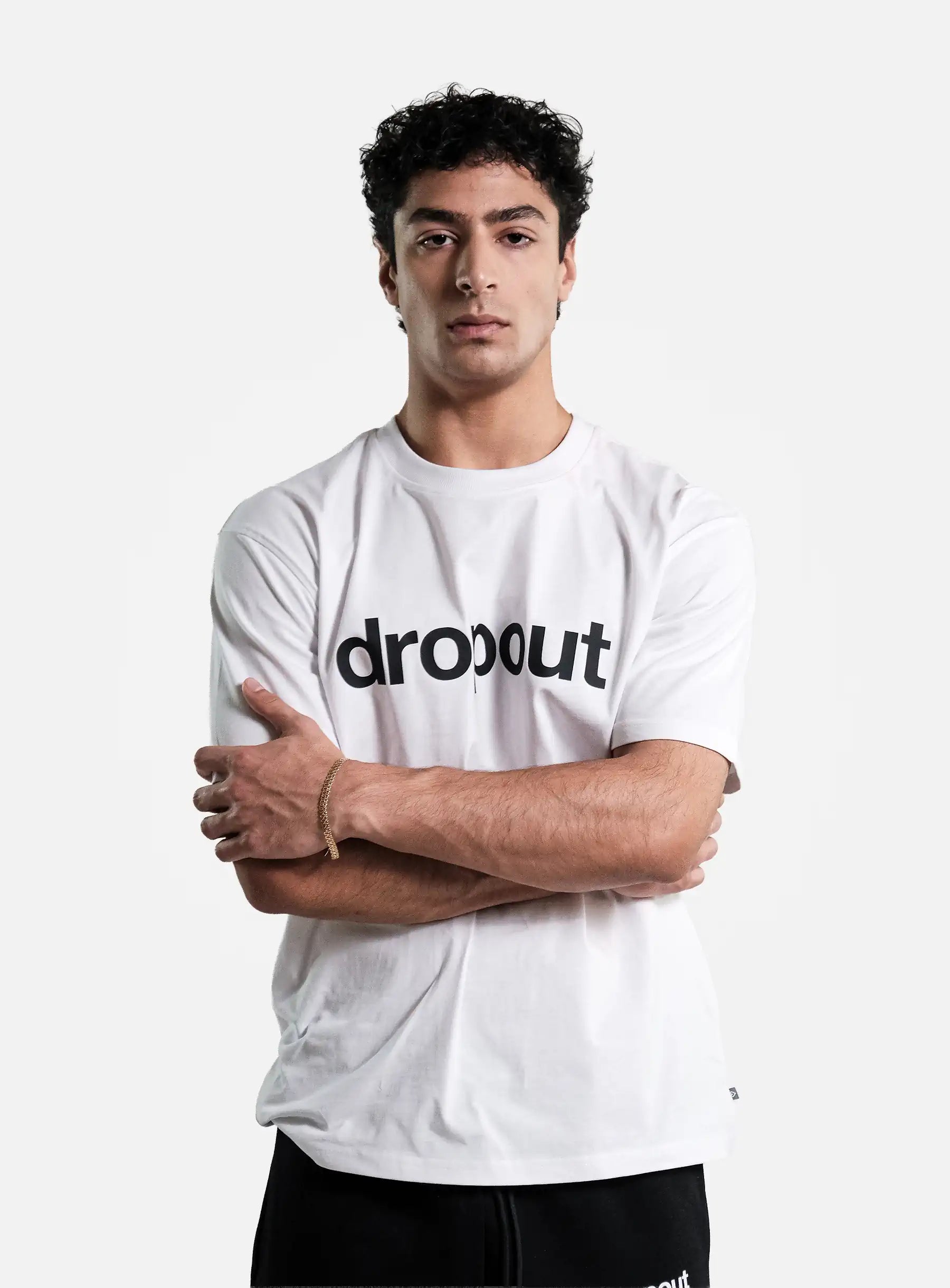 Person wearing a white t-shirt with 'dropout' logo on a white background