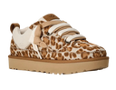 Leopard print sneaker with brown sole on a light gray background
