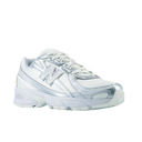 white and silver New Balance sneaker with mesh and metallic details on white background