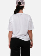 Person wearing a white t-shirt and black pants on a white background