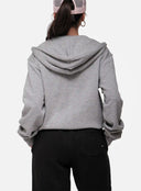 Person wearing a grey hoodie from behind on a white background