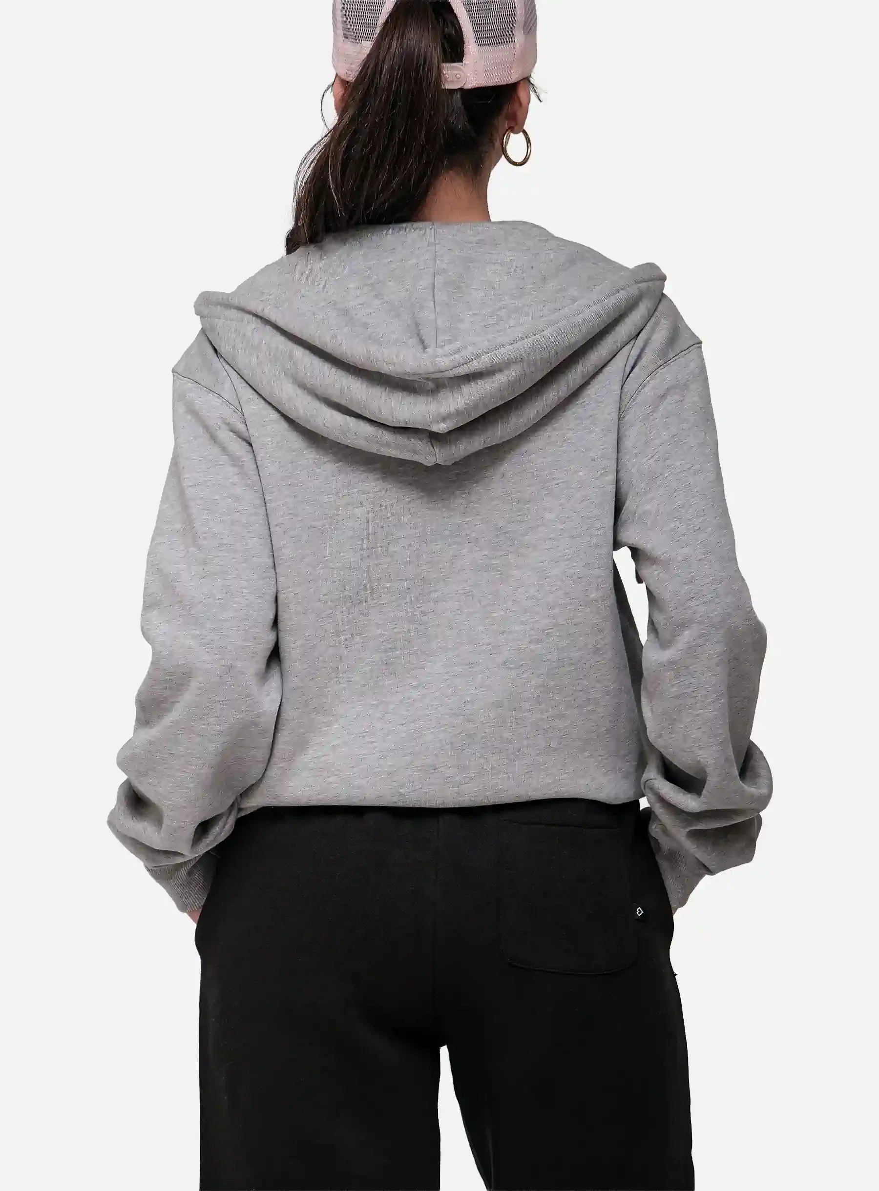 Person wearing a grey hoodie from behind on a white background