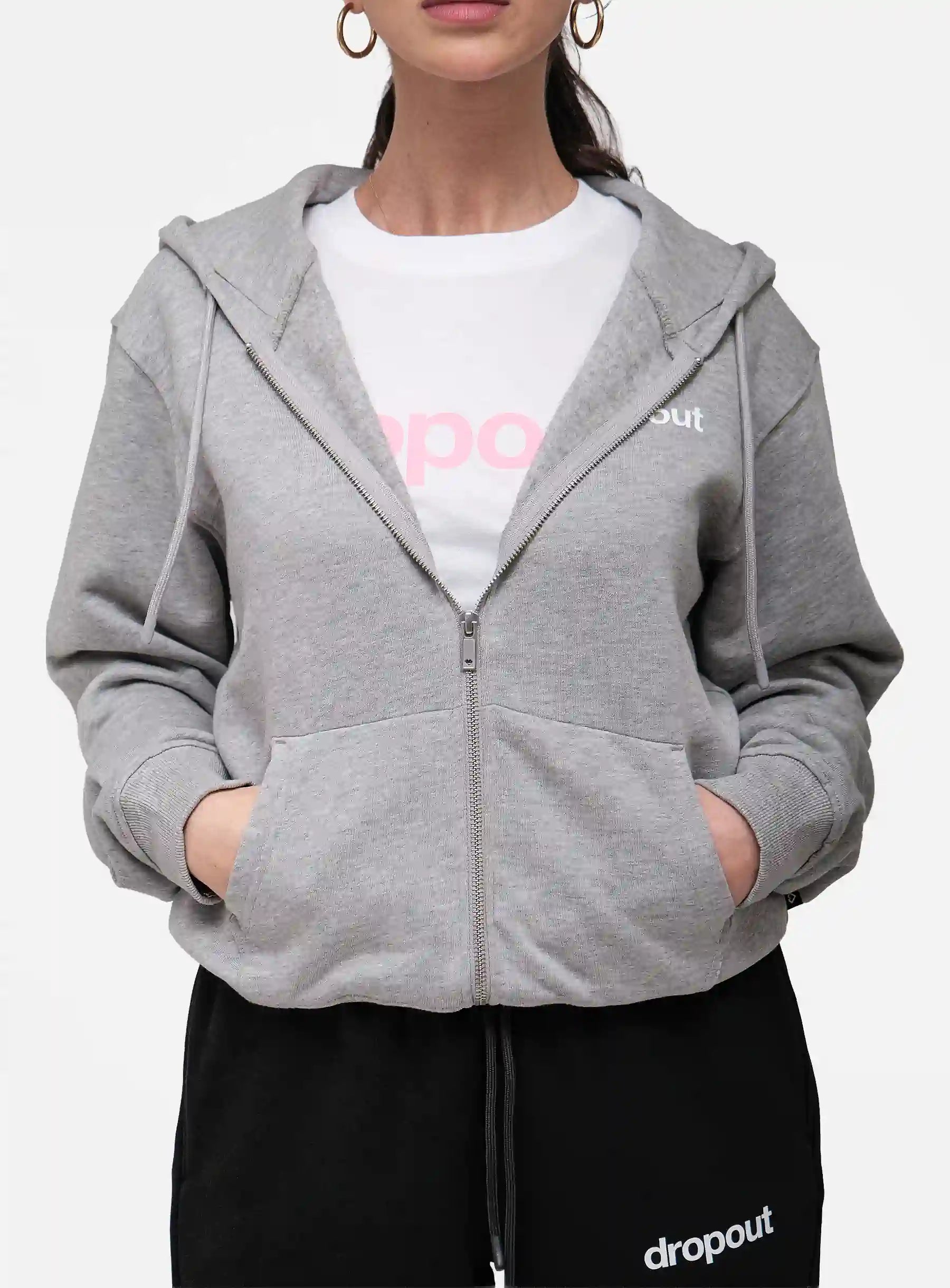 Person wearing a grey hoodie over a white shirt with 'dropout' branding.