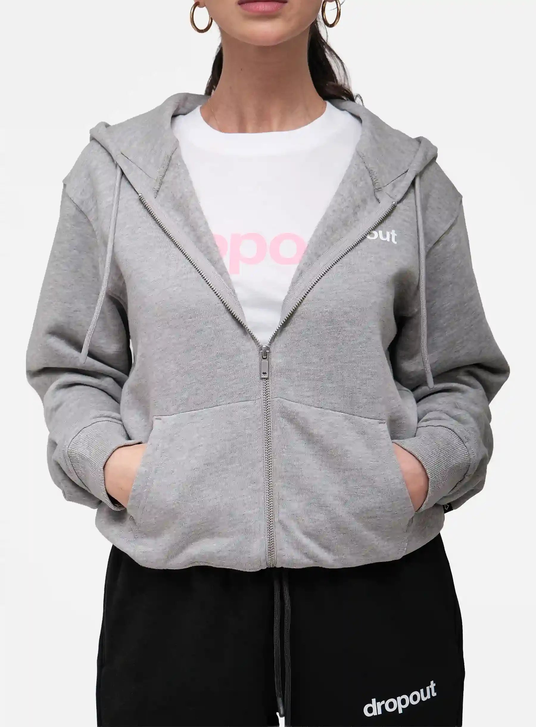 Person wearing a grey hoodie over a white shirt with 'dropout' branding.