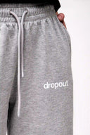 grey sweatpants with 'dropout' text on a white background