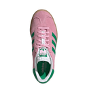 Pink Adidas sneaker with green stripes on a white background