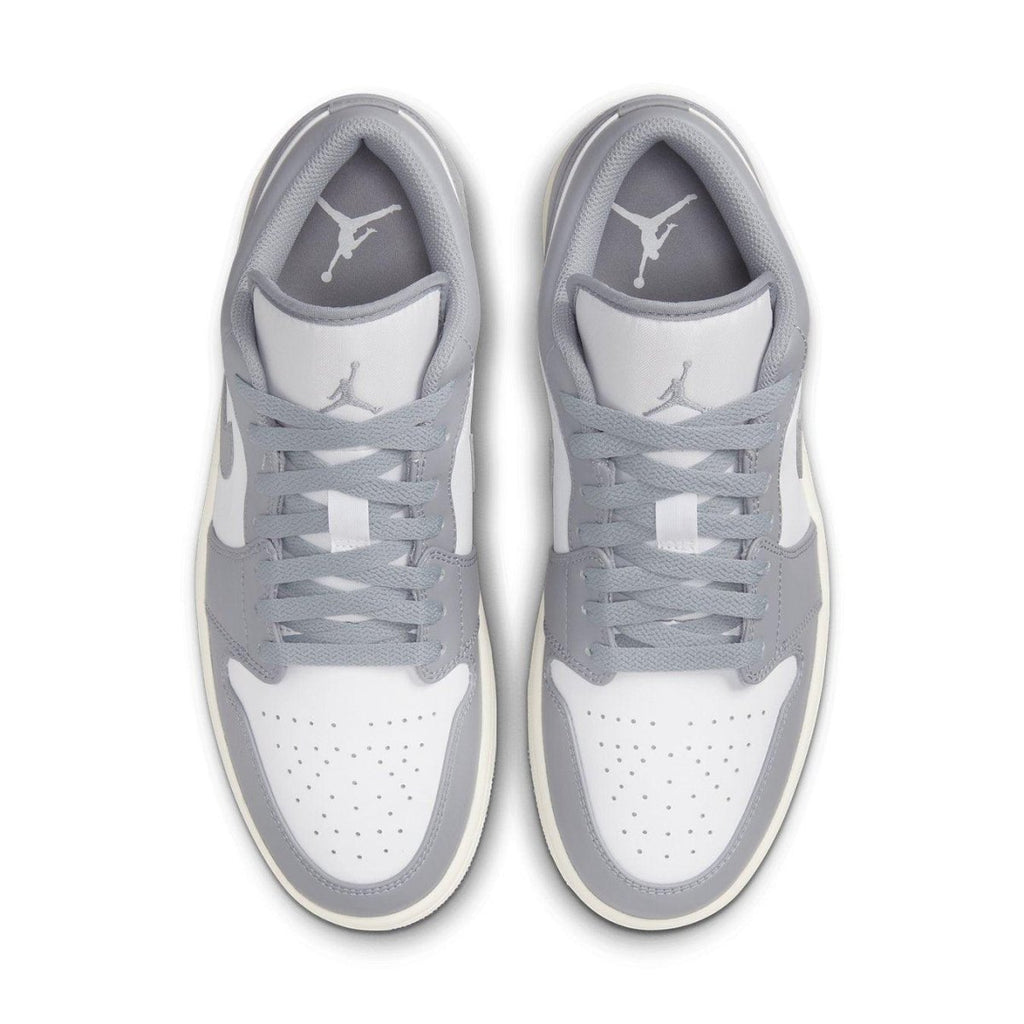 Air Jordan 1 Low Vintage Grey sneakers featuring white leather with grey overlays and classic Jumpman logo.