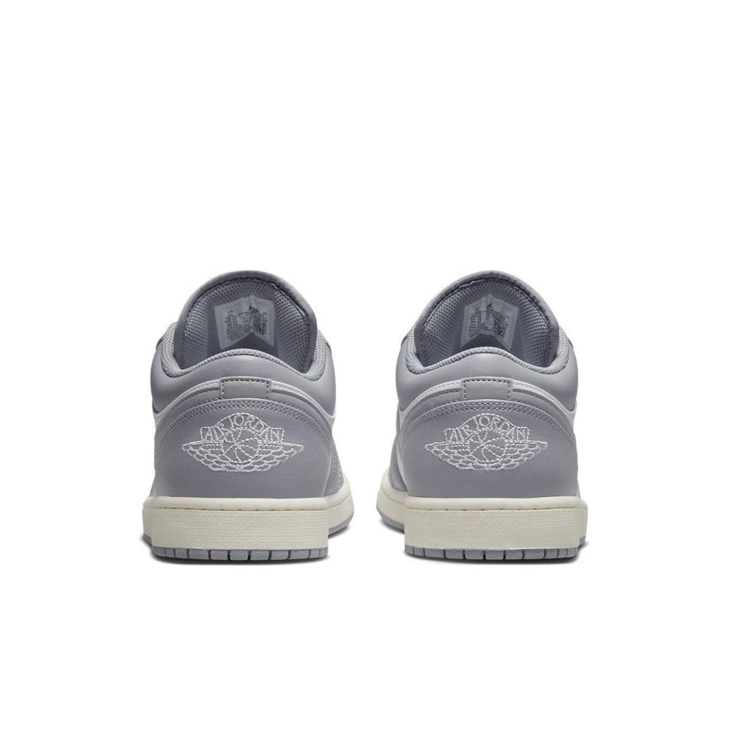Back view of Air Jordan 1 Low Vintage Stealth Grey featuring embossed Wings logo and grey leather design.