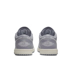 Back view of Air Jordan 1 Low Vintage Stealth Grey featuring embossed Wings logo and grey leather design.