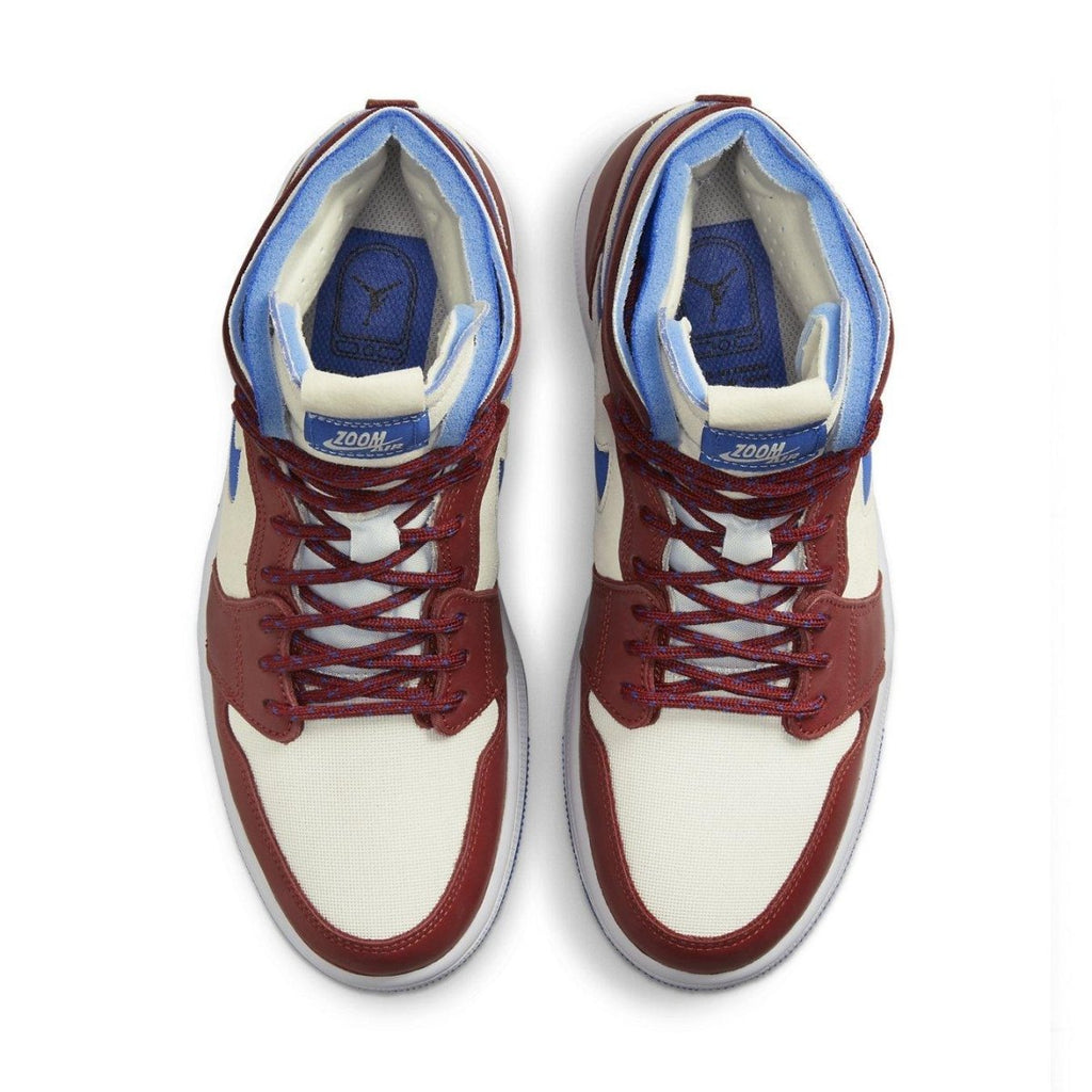 Top view of Air Jordan 1 High Zoom CMFT Team Red sneakers featuring red, cream, and blue colorway.