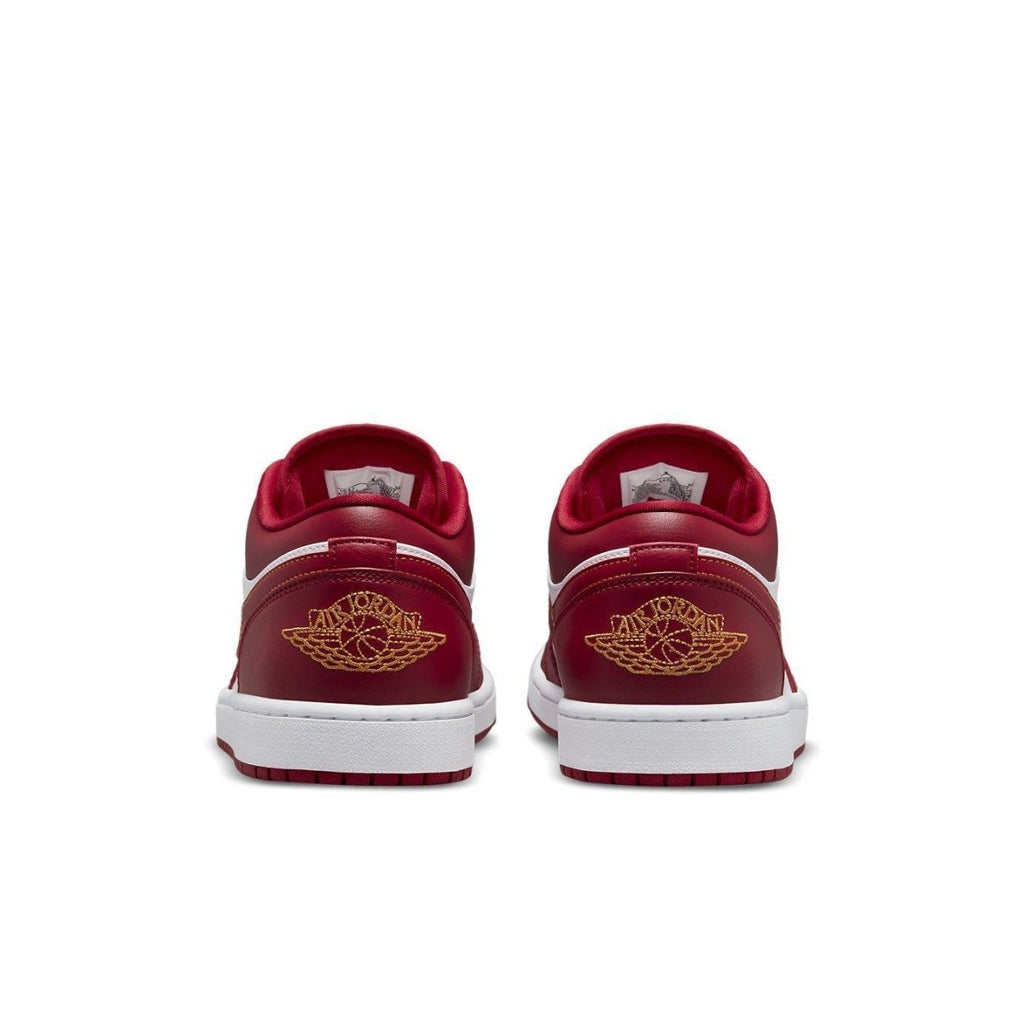 Retro Air Jordan 1 Low Cardinal Red sneaker rear view with iconic Wings logo and clean white sole.