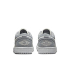 Back view of Air Jordan 1 Low SE Light Steel Grey women's sneakers showcasing embroidered logo and soft grey color.