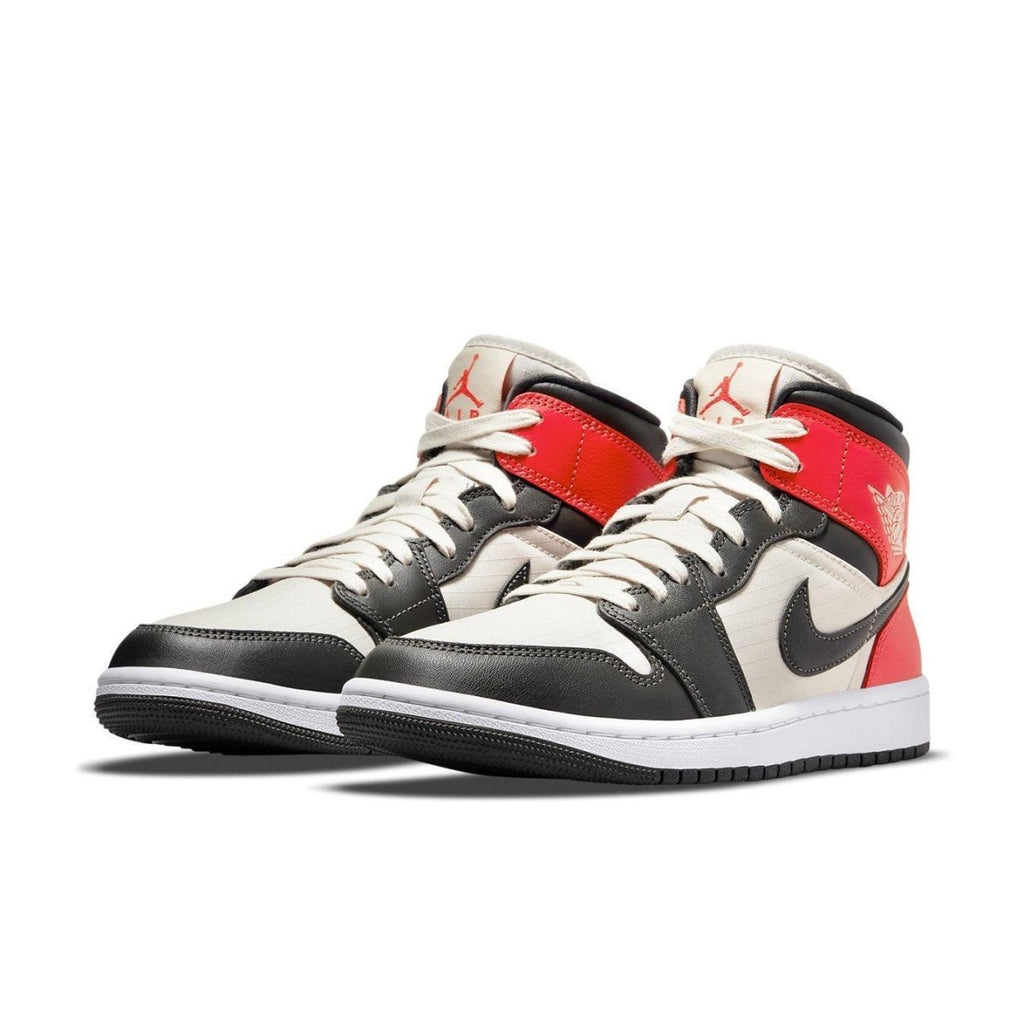 Air Jordan 1 Mid Light Orewood Brown women's sneakers in white, black, and red colorway.