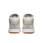 Rear view of Jordan 1 Mid SE Coconut Milk Particle Grey sneakers with suede and canvas upper.