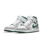 Jordan 1 Mid SE Grey Green sneaker featuring premium suede and leather, with breathable perforations and iconic logos.