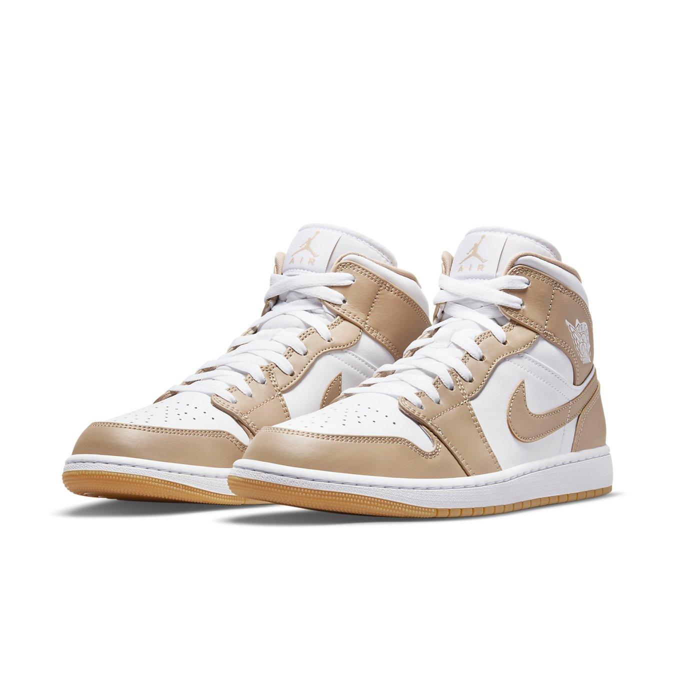 Jordan 1 Mid Tan Gum sneakers featuring a premium white and tan leather design with gum sole.