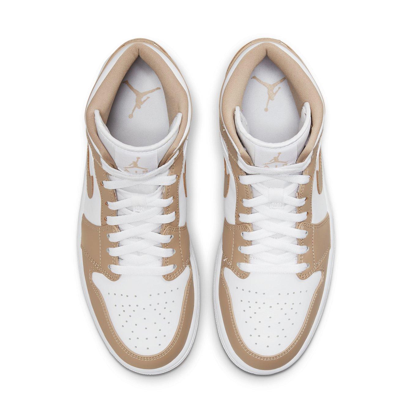 Jordan 1 Mid Tan Gum sneakers showcasing a white and tan color combination from an overhead view.