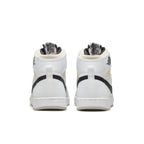 Rear view of Jordan 1 Retro AJKO sneakers in white, black, and grey fog with padded collar and logo details.