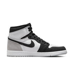 Air Jordan 1 Retro High OG Stage Haze in white, grey, and black, showcasing premium leather and suede details.