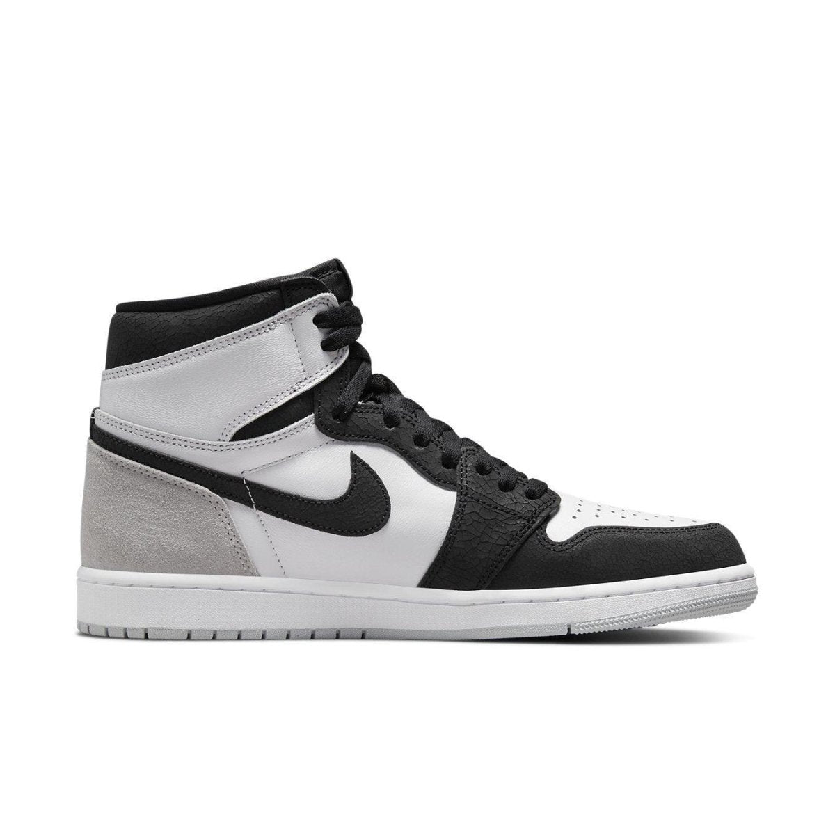 Air Jordan 1 Retro High OG Stage Haze in white, grey, and black, showcasing premium leather and suede details.