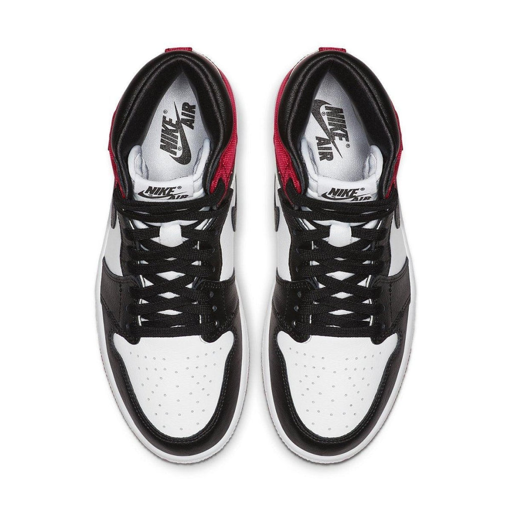 Top view of Air Jordan 1 Retro High Satin Black Toe women's sneakers with black, white, and red color scheme.