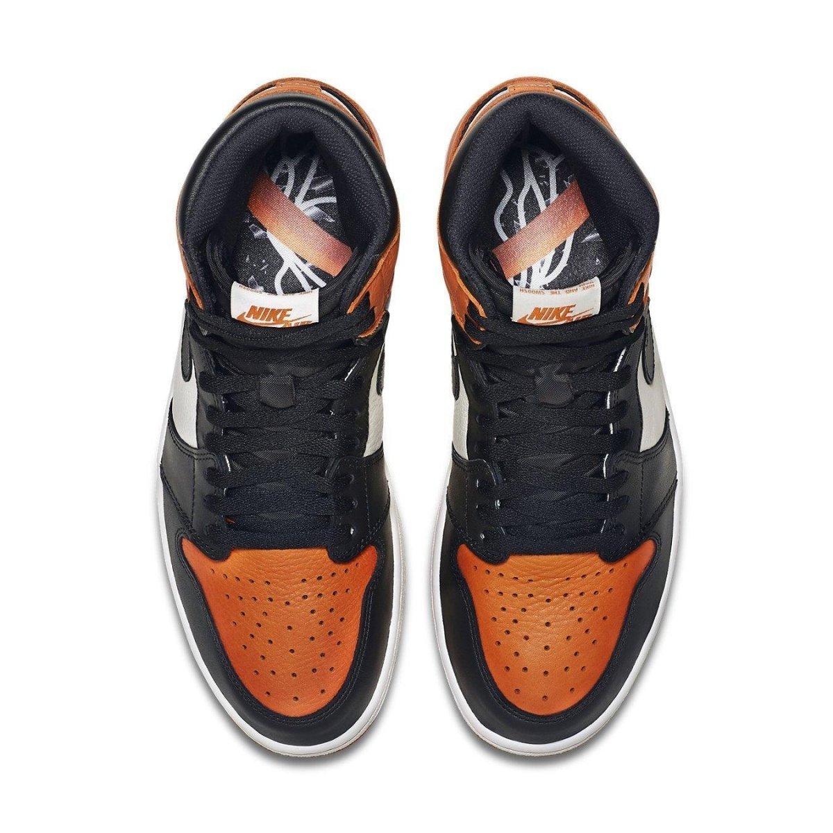 Top view of the Jordan 1 Retro Shattered Backboard sneakers in orange, black, and white colorway.