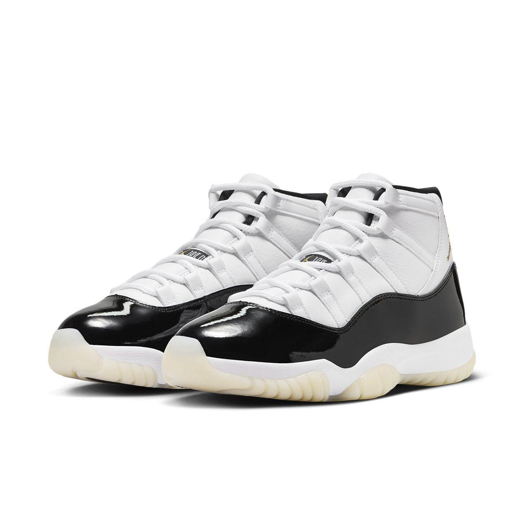 Air Jordan 11 Retro DMP Gratitude 2023 in white and black with a sleek patent leather finish.